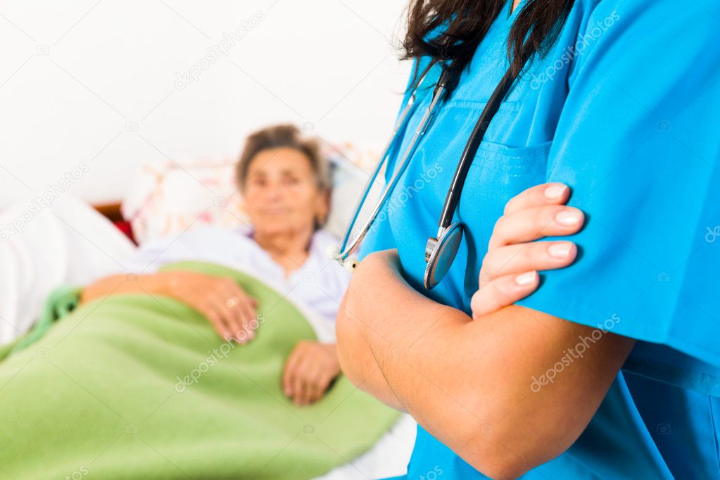 Kind nurse with elderly lady