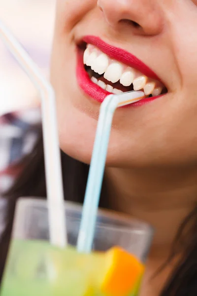 Smiling young woman with cocktail — Stock Photo, Image