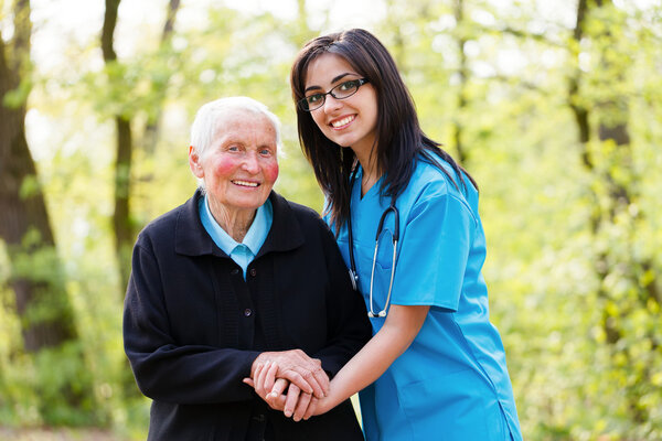 Kind Senior Lady with Nurse