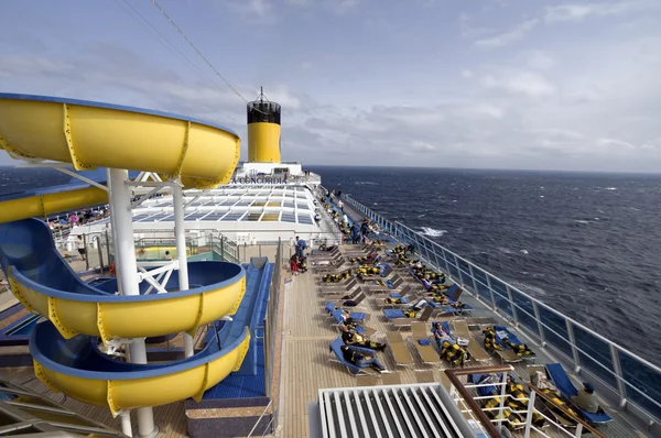 Costa Concordia ship passengers relaxing on the deck Stock Photo