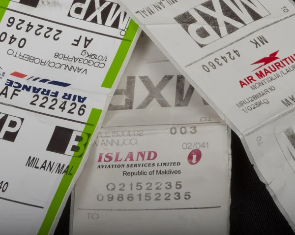 Baggage labels of different flights Stock Image