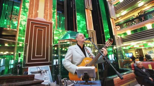 Musician in the lobby of Costa Concordia cruise ship — Stock Video