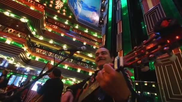 Musicians of Costa Concordia cruise ship playing in the lobby — Stock Video