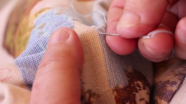 Woman sewing a tapestry at home — Stock Video