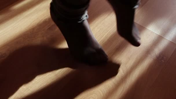 Close up of a female feet doing exercises indoors — Stock Video