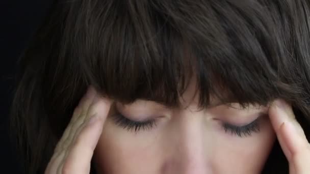 Woman having headache, close up — Stock Video