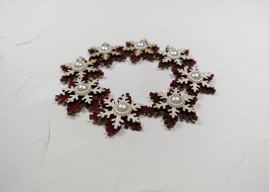 wooden snowflakes on a gray background, toys christmas decorations