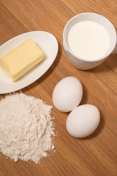 Flour with butter, milk and eggs — Stock Photo, Image