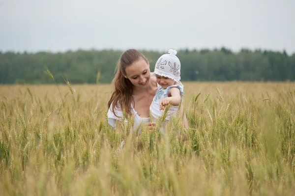 Beautiful smiling woman with child — Stock Photo, Image