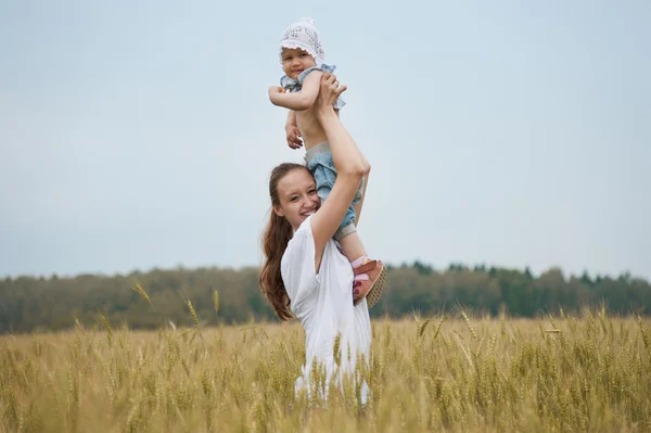Beautiful smiling woman with child — Stock Photo, Image