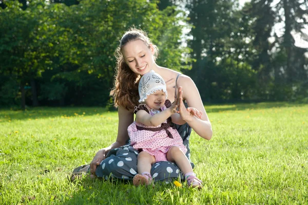 Woman plays with a daughter — Stock Photo, Image