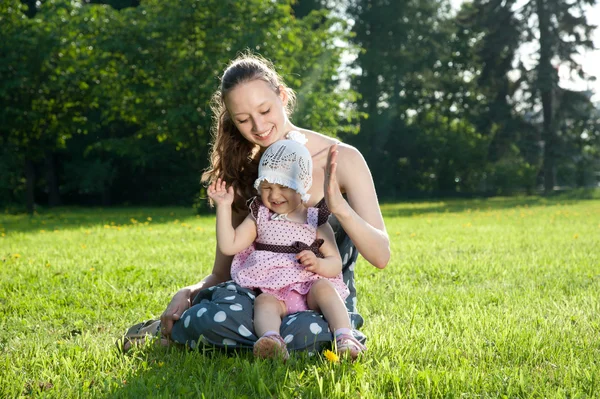 Woman plays with a daughter — Stock Photo, Image