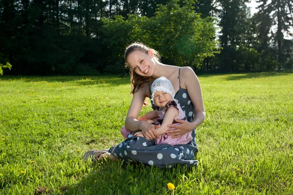 Woman sits with a daughter — Stock Photo, Image