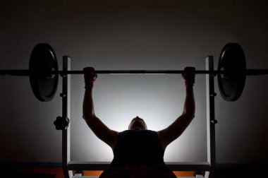 Man weightlifter at the gym clipart