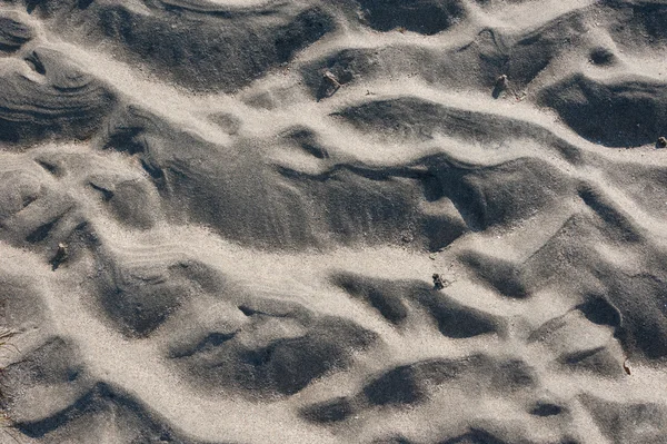 Grey sand of the beach — Stock Photo, Image