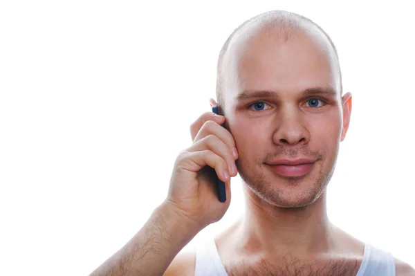 Homem falando ao telefone no fundo branco — Fotografia de Stock