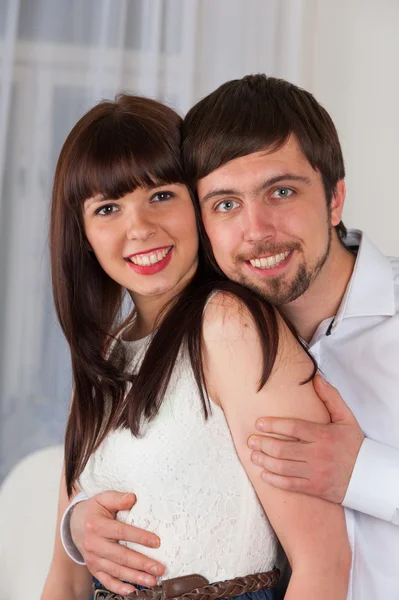 Portrait of smiling couple at home — Stock Photo, Image