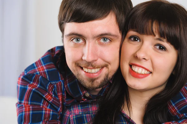 Closeup portrait of young smiling couple — Stock Photo, Image