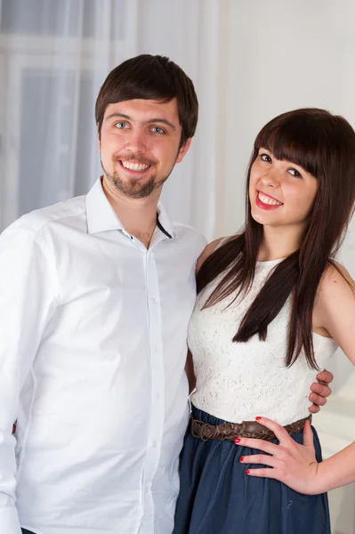 Young couple at home in living room — Stock Photo, Image