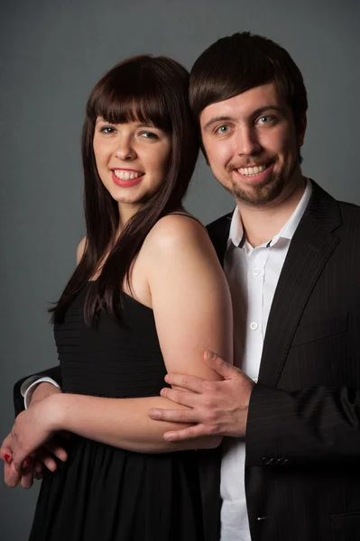 Couple on grey background — Stock Photo, Image