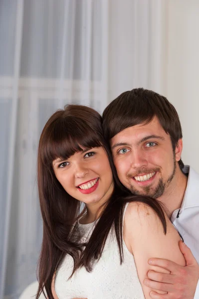 Young smiling couple at home — Stock Photo, Image