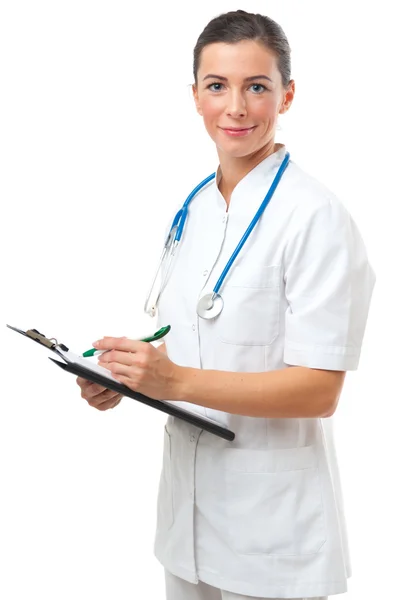 Female doctor writing on clipboard — Stock Photo, Image