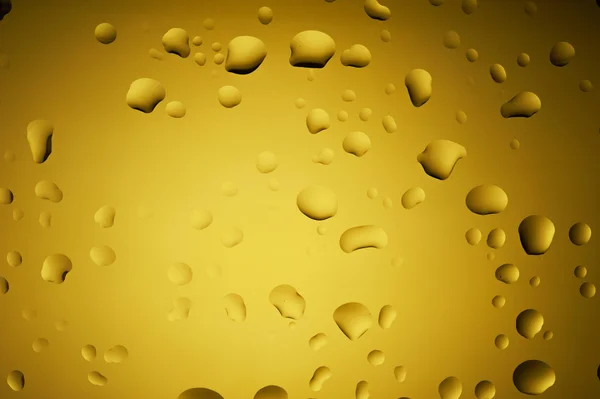 Gold yellow drops of water on glass — Stock Photo, Image