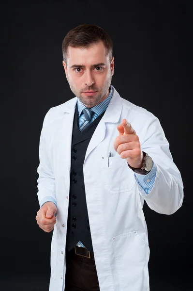 Doctor pointing at camera — Stock Photo, Image