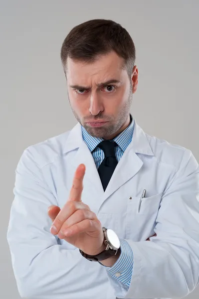 Doctor pointing finger in air — Stock Photo, Image