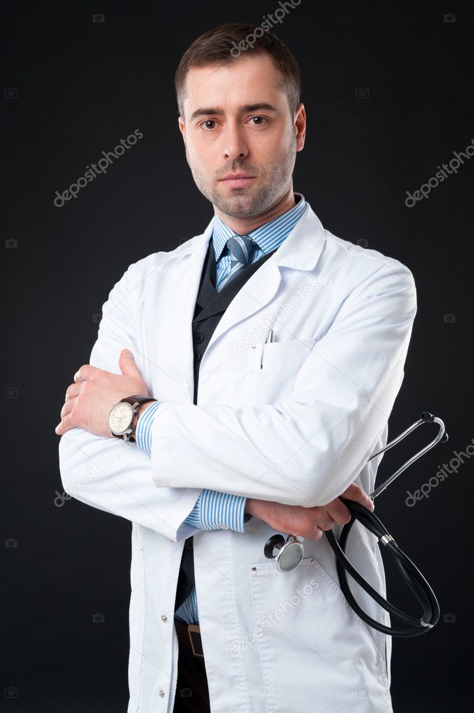 Doctor holds stethoscope Stock Photo by ©maxsaf 40587027