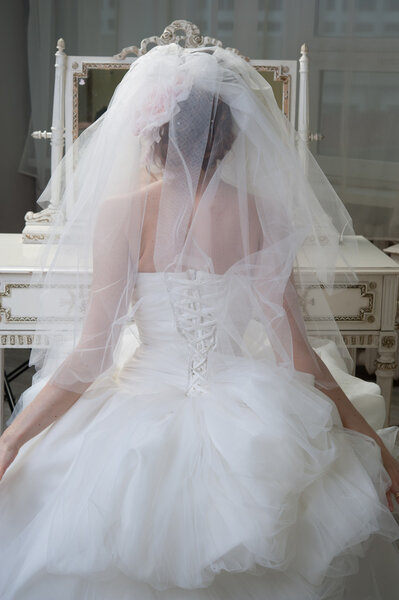 Bride looking in mirror