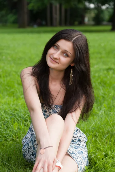 Girl relaxing on grass — Stock Photo, Image