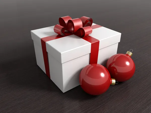 Coffret cadeau avec boules de Noël et ruban rouge — Photo