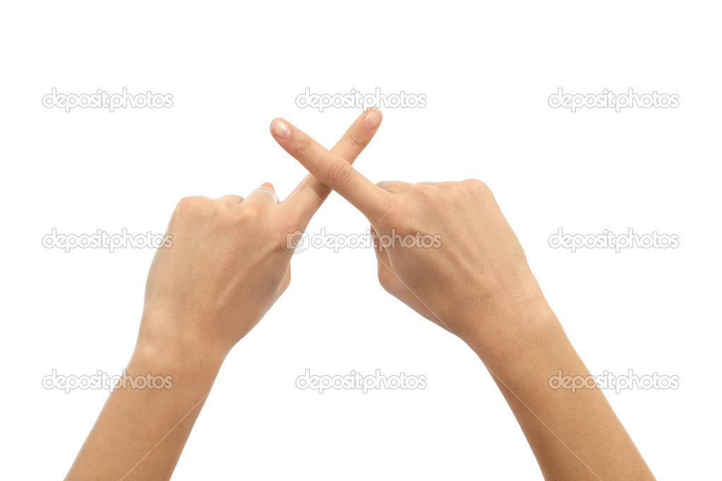Woman hands crossing fingers