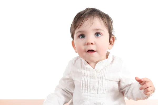 Bebé desconcertado mirando hacia arriba con grandes ojos azules —  Fotos de Stock