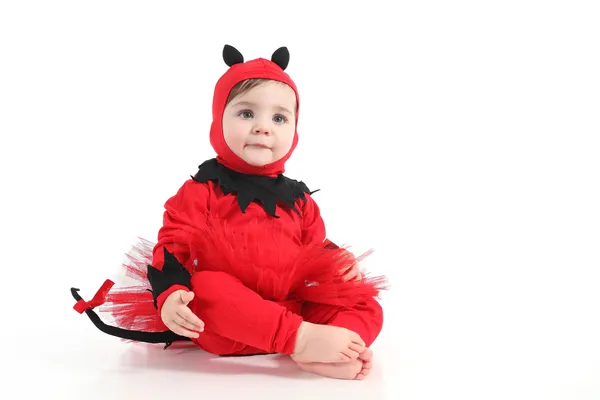 Barnet med en röd demon förklädnad — Stockfoto