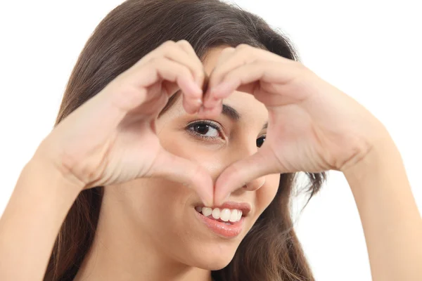 Beautiful woman making a heart shape — Stock Photo, Image