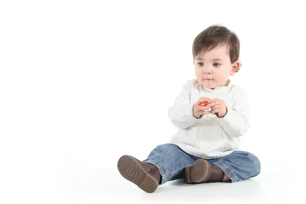 Baby with a candy in her hands — Stock Photo, Image