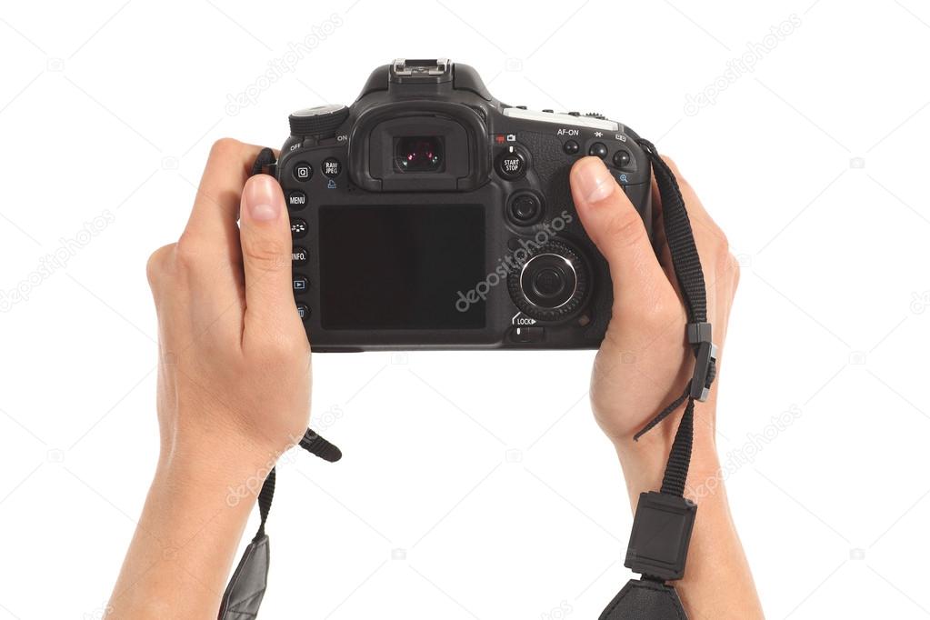 Beautiful woman hands holding a dslr camera