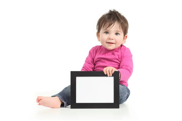 Bebê mostrando uma moldura em branco — Fotografia de Stock