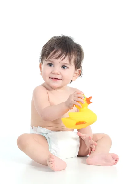 Bebê brincando com um pato de borracha — Fotografia de Stock