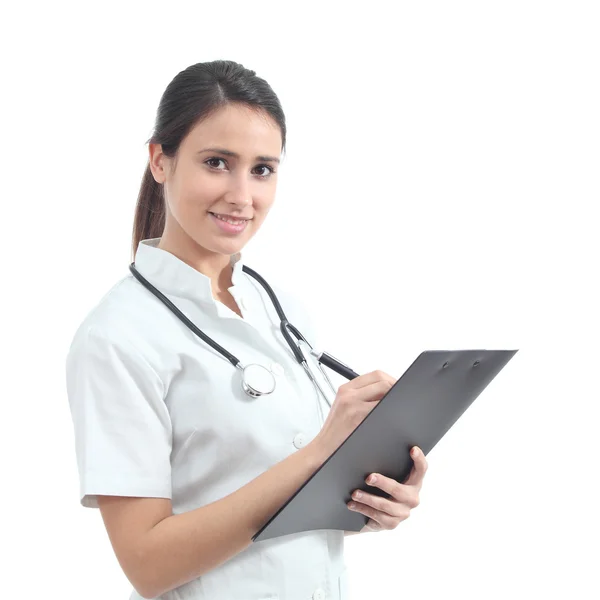 Beautiful nurse smiling and taking notes Stockfoto