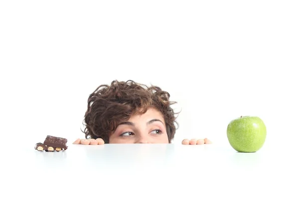 Beautiful woman choosing the apple — Stock Photo, Image