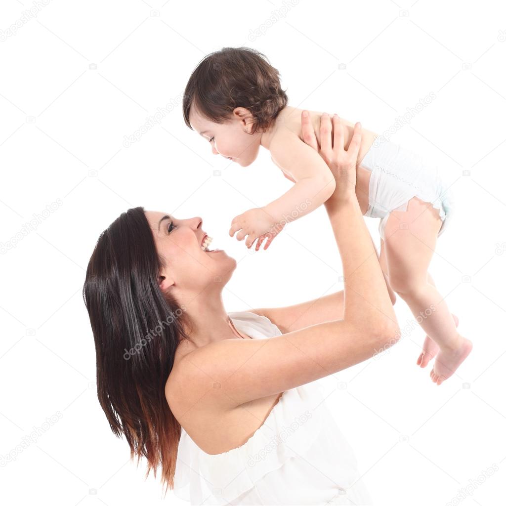 Attractive mother laughing and raising her daughter