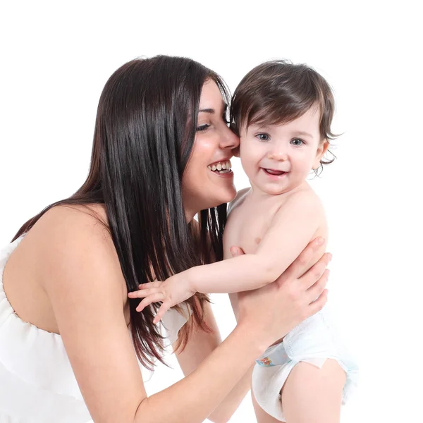 Attractive mother embracing her baby Stock Photo