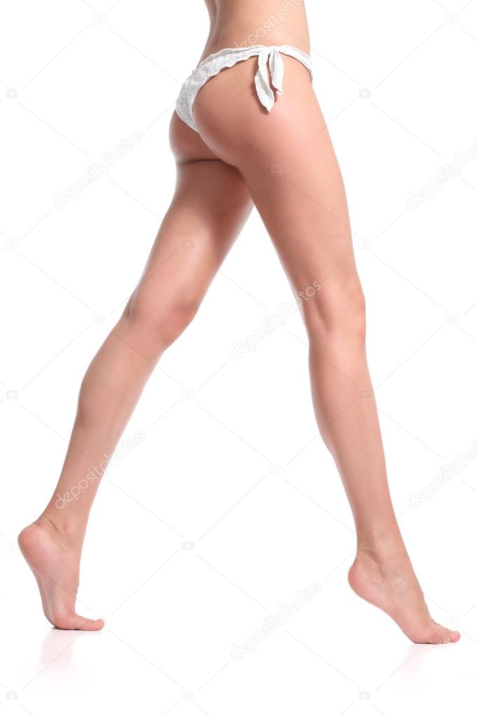 Side view of a beautiful naked legs of a woman walking