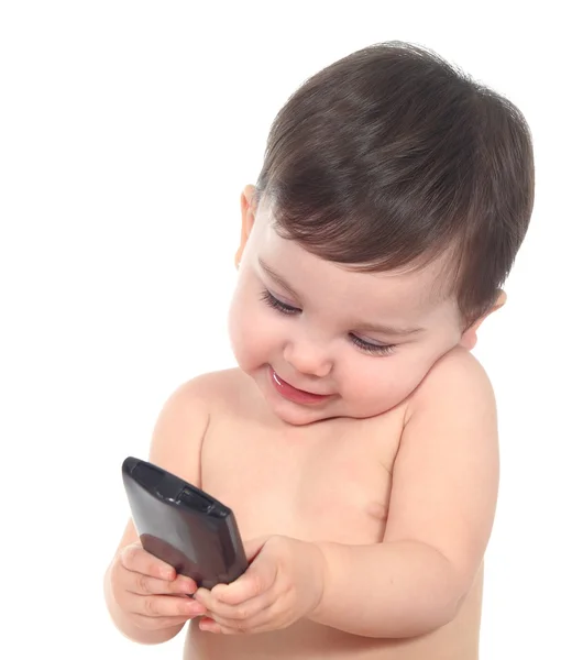 Belo bebê brincando e tocando um telefone inteligente — Fotografia de Stock