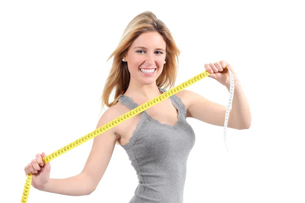 Mutlu bir kadın ölçü birimi teybi germe — Stok fotoğraf