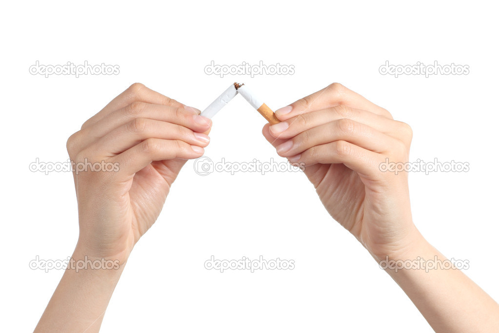 Woman hands breaking a cigarette