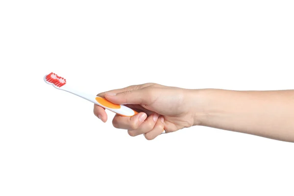 Woman hand holding a toothbrush — Stock Photo, Image